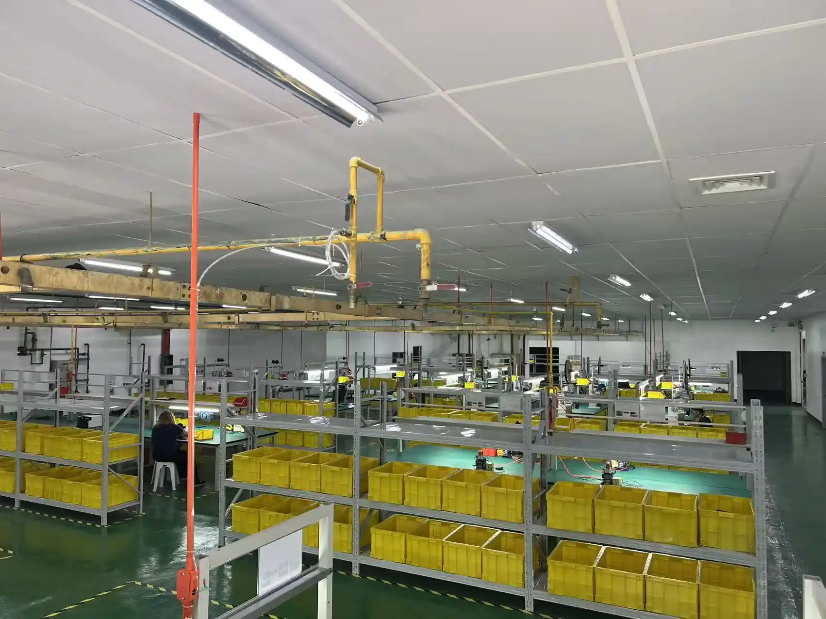 Lot-tracked material bins and workstations on the Cavite production floor